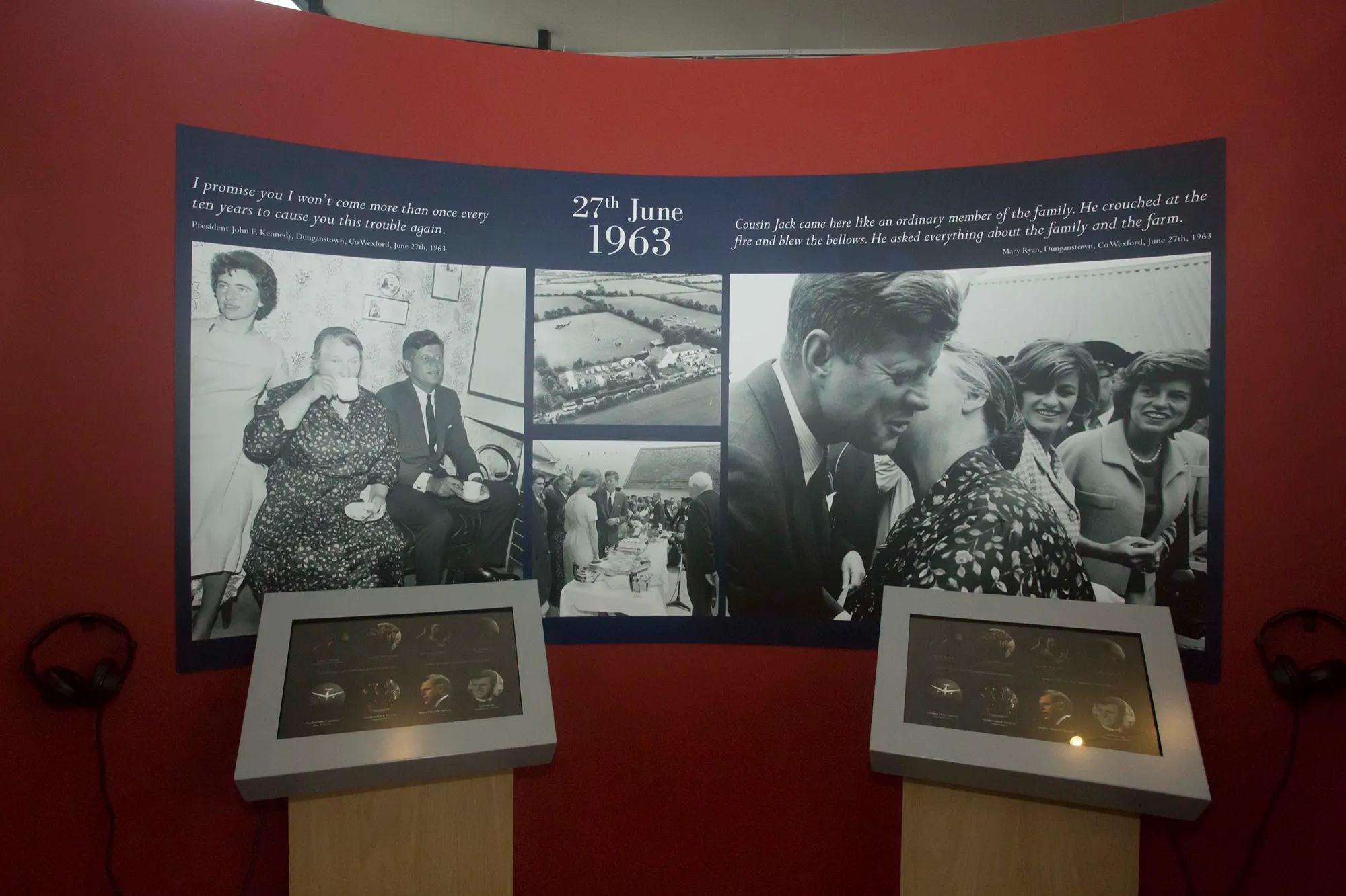 An exhibition wall headed 27th June 1963, with large photographs of the President among his cousins and two listening points with headphones below.